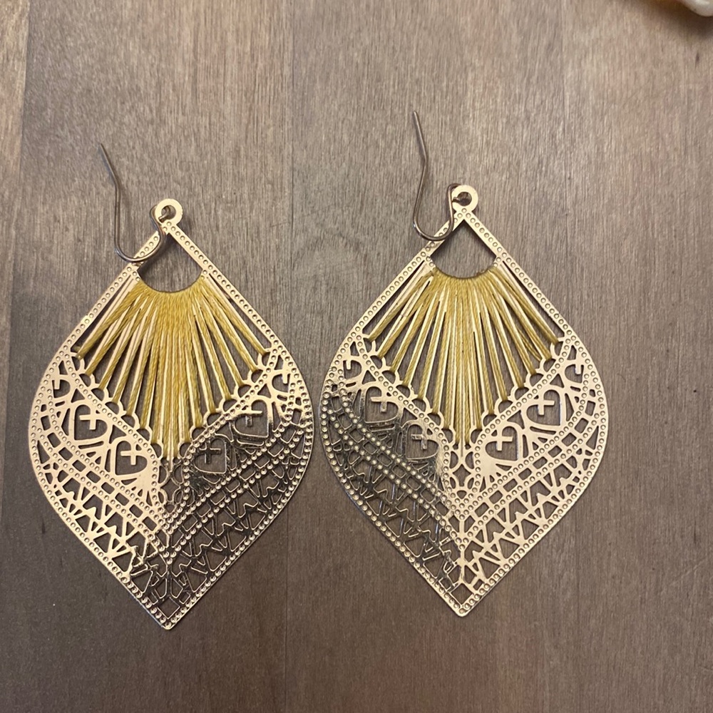 Costume jewelry gold with yellow accent.